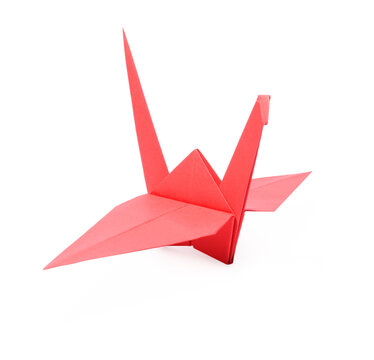 Origami art. Beautiful red paper crane isolated on white