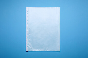 Punched pocket on light blue background, top view