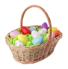 Wicker basket with beautifully painted Easter eggs isolated on white