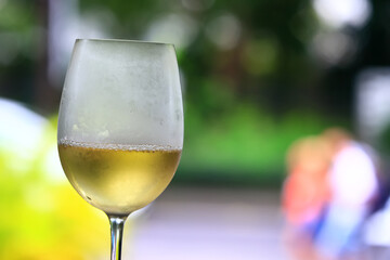 a glass of white wine in a restaurant, alcohol luxury background