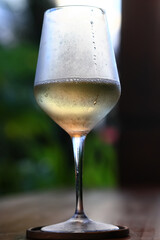 a glass of white wine in a restaurant, alcohol luxury background