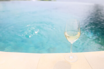 white wine tasting, chilled ice wine in a cold glass in summer