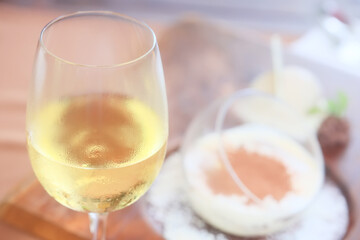 a glass of white wine in a restaurant, alcohol luxury background