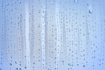 drops glass blue background abstract, transparent cold background water splashes