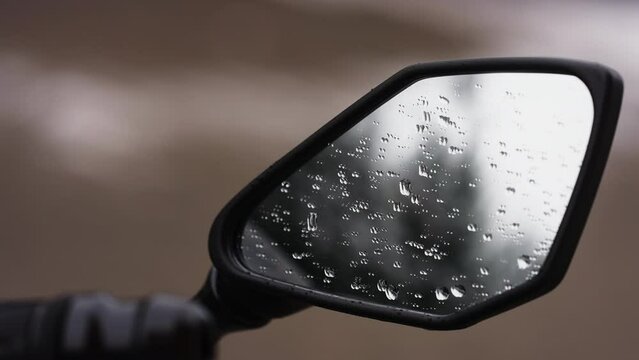 Water droplets on a side mirror of Kawasaki Ninja motorcycle