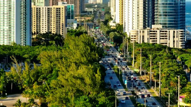 Aerial transition from traffic to highrise Miami Beach buildings