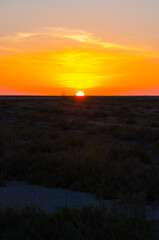 Beautiful sunset on salt lake Chott el Djerid, Sahara desert, Tu
