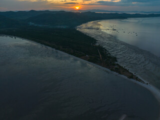 Naklejka premium Aerial view sunset shot made with drone on the island of Koh Yao Yai, Phuket. .4K Shooting With Drone. Beach in tropical paradise, Koh Yao Yai island in Phang-nga, Thailand. .Landscape with tropical.