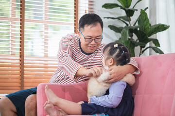 Asian father and daughter playing together at home, Family concepts