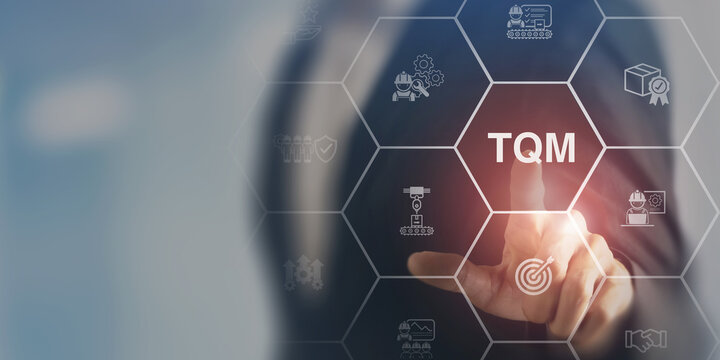 Total quality management (TQM) concept. Touching on smart screen with TQM text on smart background. Management approach to long-term success through customer satisfaction and sustainability.