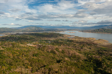 Lake in a valley among mountains with tropical vegetation. Philippines.