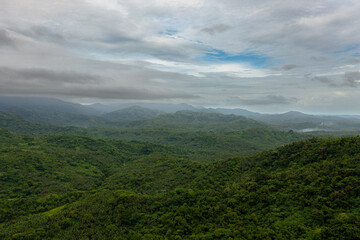 Aerial view of Mountain peaks covered with forest from above. Philippines.