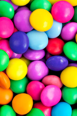 Fototapeta na wymiar 3d illustration of mixed spherical colored chocolates