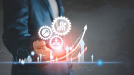 Business chart and graph concept. Businessman analyze the arrow growth chart or graph in virtual hologram. Financial and banking business investment strategy, profit increasing trend.