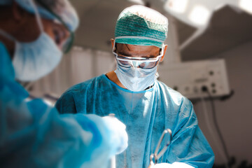 Surgical team treating a neurosurgical brain tumor