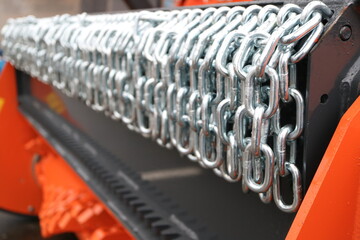 Fototapeta premium number of mounted cultivator chains.