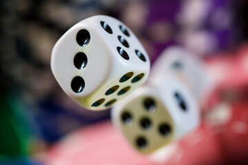 Dices flying on a casino table.