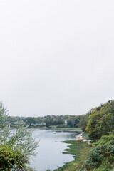 boats on the beach of inlet on cloudy day on Cape Cod