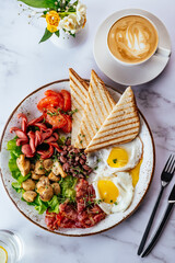 english breakfast with scrambled eggs, bacon, beans, mushrooms a