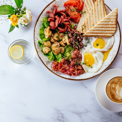 english breakfast with scrambled eggs, bacon, beans, mushrooms a