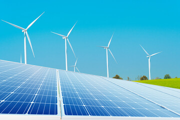 Solar panel and Wind Turbines on green field ,blue sky, clean energy sustainable for smart city.	