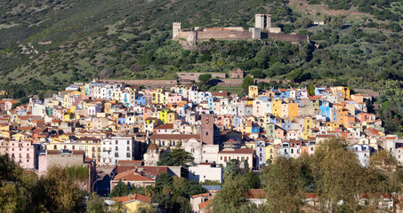 Fototapeta na wymiar Homes and Apartments in Touristic Town. Bosa, Sardinia, Italy. Sunny Fall Season Day.