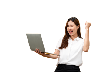Young asian woman wearing white short sleeve shirt and holding laptop to working while smiling and raising one arm to celebrate after successfully work isolated