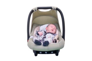A child boy in an infant car seat, isolated on a white background. Infant baby in carrying. Kid aged two months