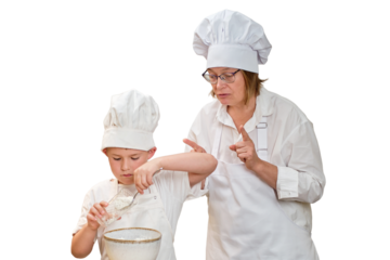 Mother and son cooking apple pie in the home kitchen, isolated on a white background. A woman and a boy in chef hats and aprons cook with pastries