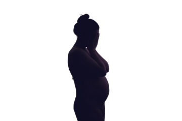 Young pregnant woman crying with her hands folded near her face, isolated on a white background. Pregnancy problems, silhouette of the expectant mother at the night window