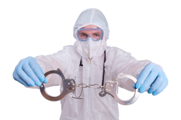 A paramedic in a protective uniform in a medical face mask with handcuffs in his hands, isolated on a white background
