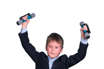 A boy in a school suit is doing sports with dumbbells, isolated on a white background