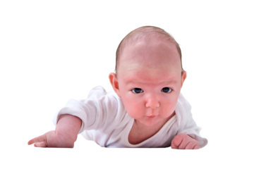 A baby aged 1 month learns to keep his head lying on his stomach, isolated on a white background. Caucasian boy child in a home white bedroom
