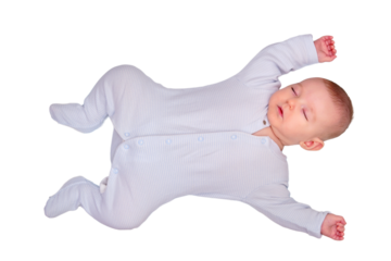 The infant baby sleeps in a star shaped pose with his arms and legs spread out on a child bed, isolated on a white background. Kid is three months old