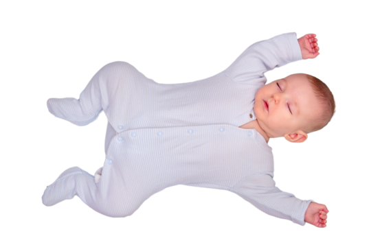 The infant baby sleeps in a star shaped pose with his arms and legs spread out on a child bed, isolated on a white background. Kid is three months old