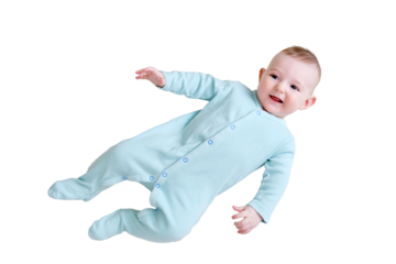Happy baby lies in mint color clothes, isolated on a white background. Smiling child in turquoise pajamas, top view. Kid aged six months
