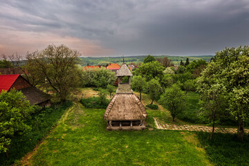 Old wooden bell tower with thatched roof. The region's symbolic landmark.  Part of the Orseg...