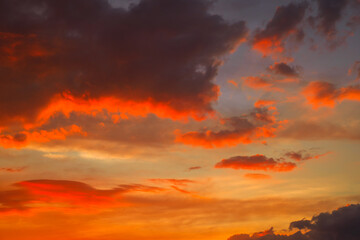 Beautiful colorful dramatic sky with clouds at sunset or sunrise. Abstract sky background