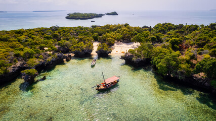 Experience Zanzibar's Blue Safari on a traditional wooden dhow boat. Dive into coral reefs, explore deserted islands in the middle of the ocean