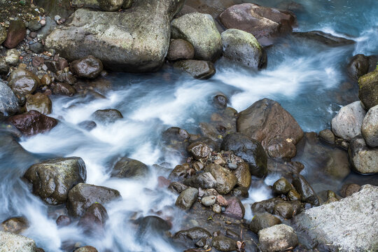 The Beauty of Nature's Textures: Slow Shutter Speed Photos of Water Flowing Among the Rocks
