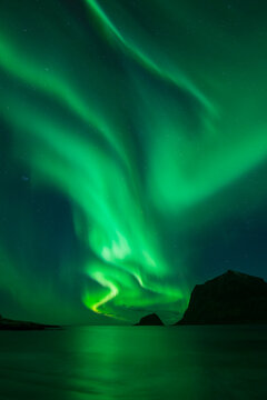 Northern Lights - Aurora Borealis shine in Sky over Vik Beach, Vestv&Atilde;&yen;g&Atilde;&cedil;y, Lofoten Islands, Norway