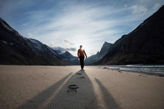 Female hiker leaves footprints in sand on scenic Horseid beach, Moskenes&Atilde;&cedil;y, Lofoten Islands, Norway