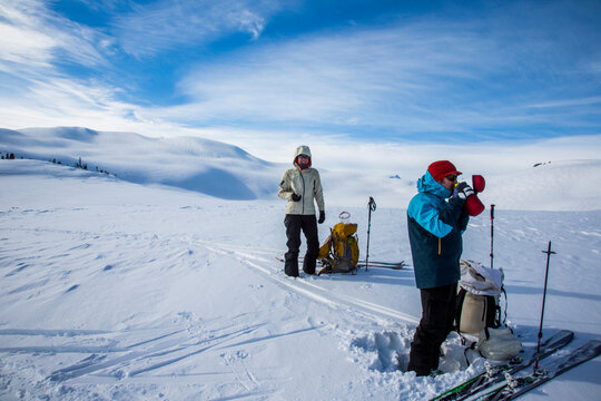 Skiers in the backcountry while completing the Spearhead Traverse near Whistler, British Columbia, Canada.