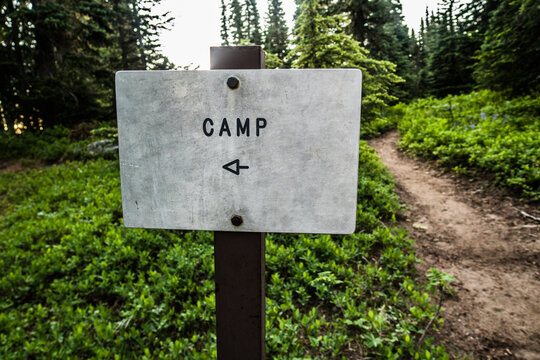 A sign pointing to camp along the Pacific Crest Trail.