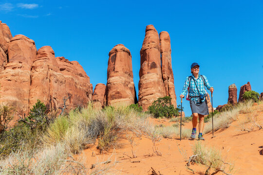 Front view of a female hiker in the Arches National Park.