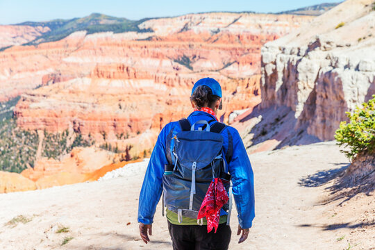 A female hiker in the scenic view of Cedar Breaks National Monument.