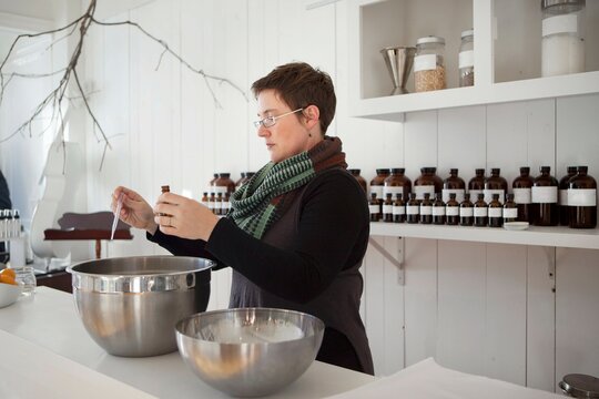 Woman working in perfume store