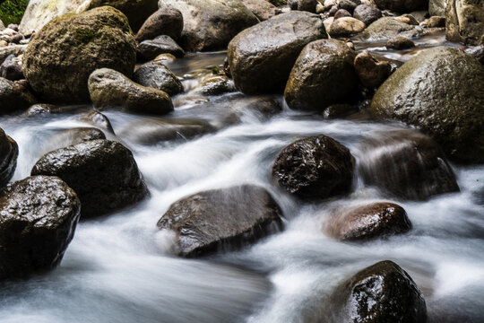 Nature's Harmony: Slow Shutter Speed Photos of Water Flowing Among the Rocks