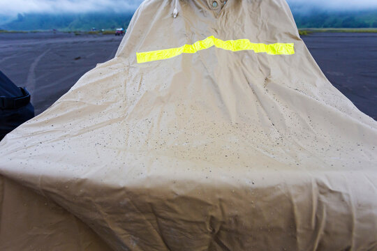 Man in rain coat with volcanic dust,Bromo,Java,Indonesia