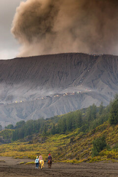 Horse riders near Mt.Bromo in early morning.Java.Indonesia